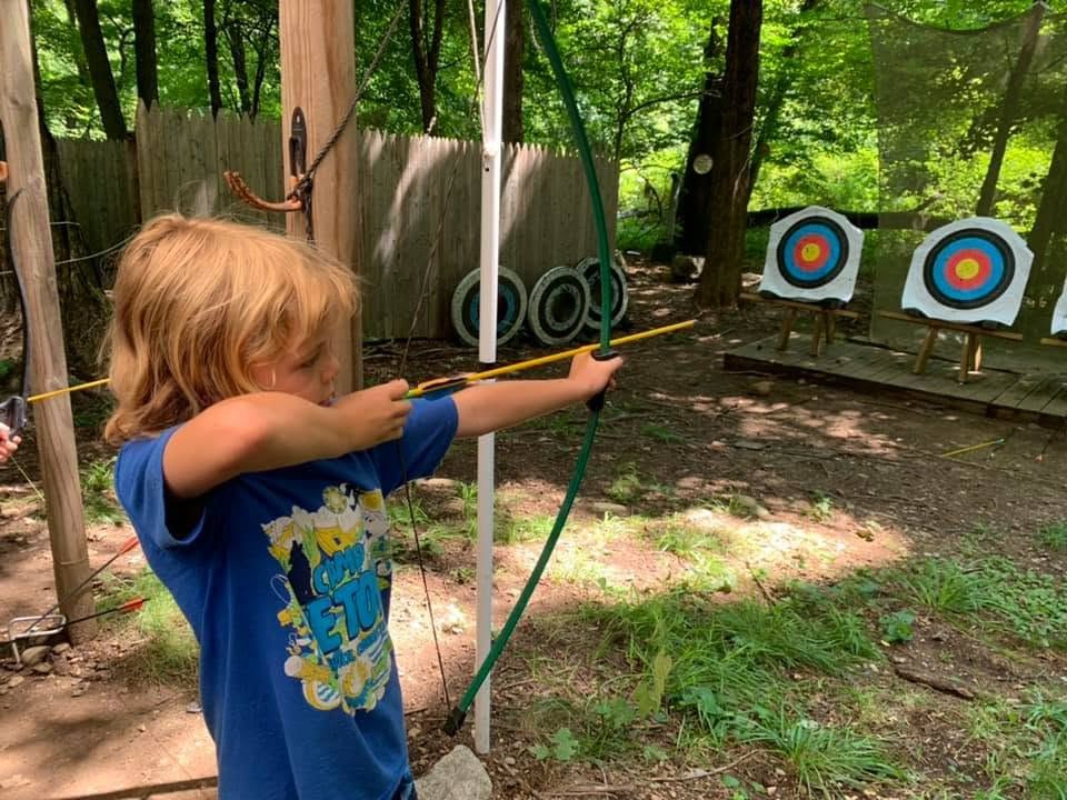Young Scout practicing archery