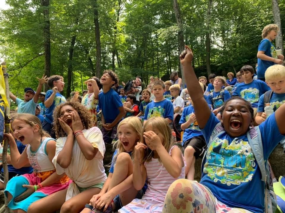 Scouts cheering together at camp